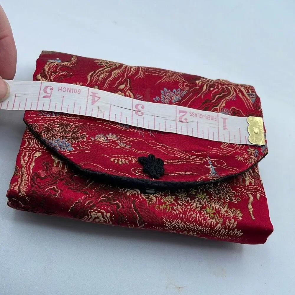 Vintage silk brocade jewelry roll. Snap front.